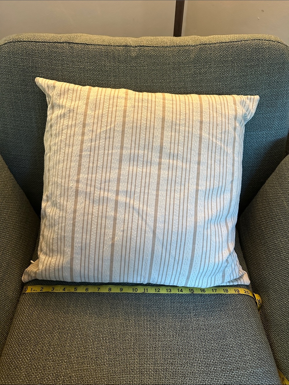 Beige and off-white throw pillow